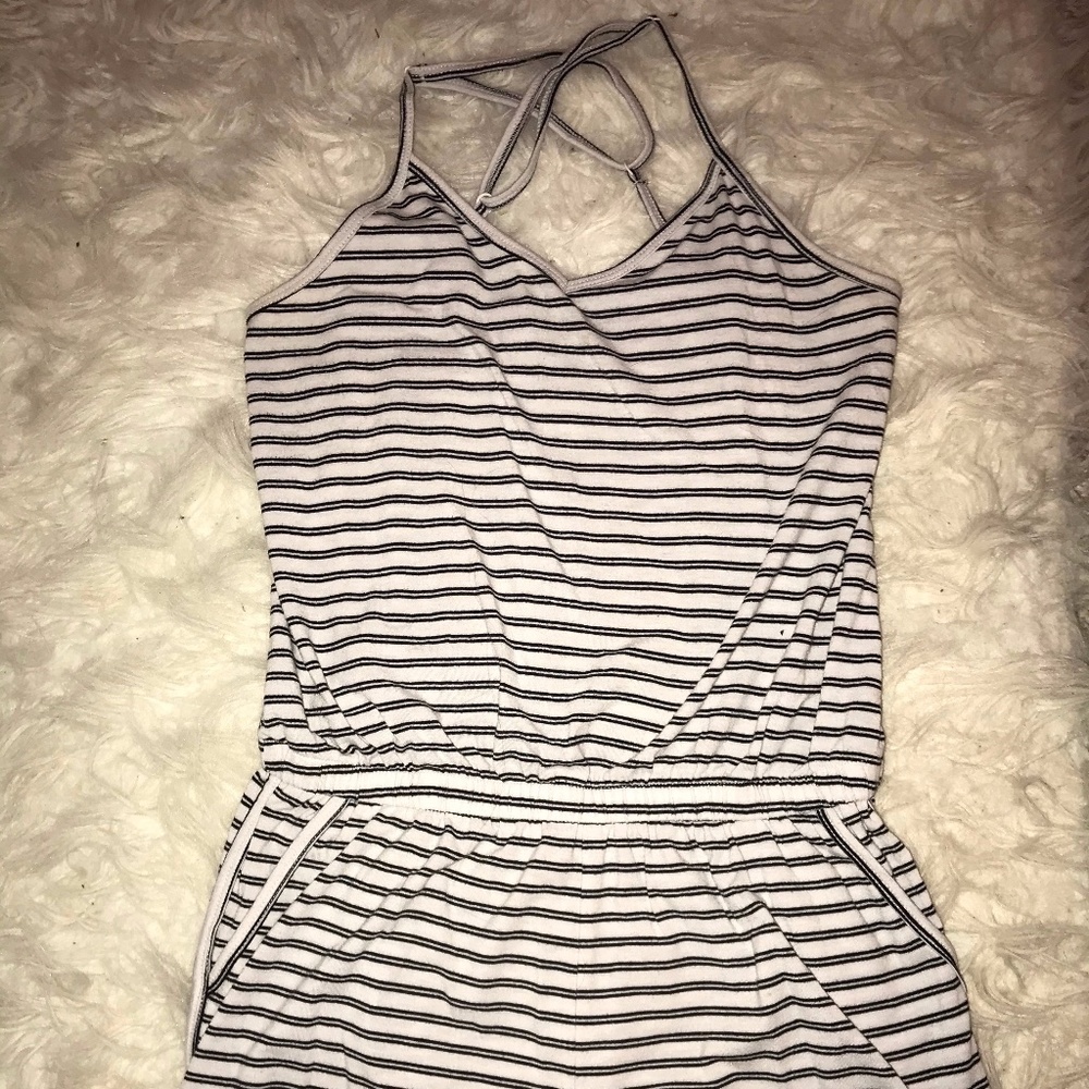 Small v neck striped romper with pockets.